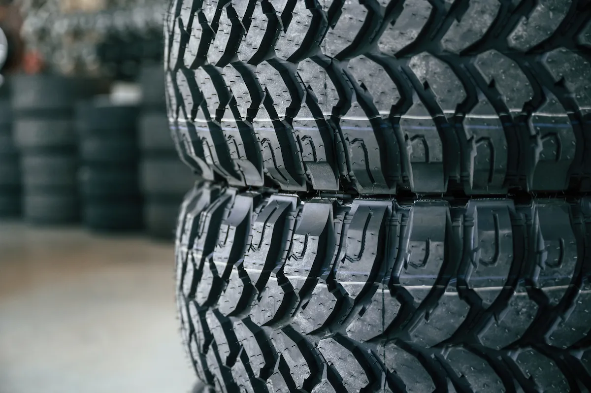 new-tires-are-placed-on-the-storage-rack-in-the-ca-2025-03-18-21-17-33-utc